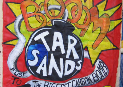 bomb with exploding tar sands image