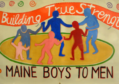 Men and boys joining hands building true strength - Maine Boys to Men