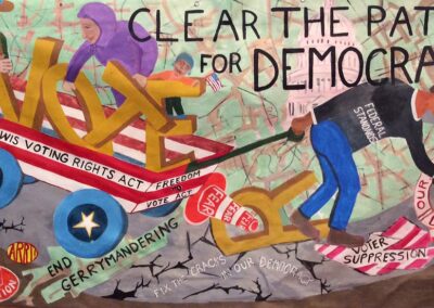 man pulling wagon with Vote in it amid broken infastructure - Clear the Path For Democracy