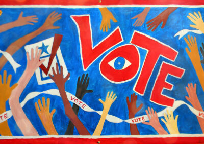 VOte is surrounded by hands