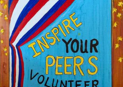 Sign reads inspire your peers volunteer at the polls