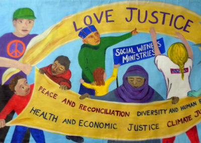 Marginalized people join together to hold banners for the love of Justice