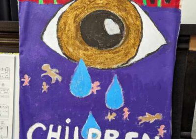 a large eye with tears and "save Children" text