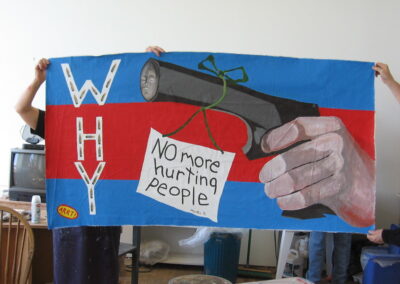 a hand gun with a red flag tied to the barrel reads No more hurting people and big word - WHY